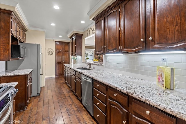 15037 Hiawatha St, Mission Hills San Fernando, CA 91345 - kitchen featuring appliances with stainless steel finishes, dark wood-type flooring, ornamental molding, recessed lighting, and tasteful backsplash
