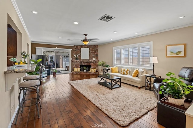 15037 Hiawatha St, Mission Hills San Fernando, CA 91345 - living area featuring crown molding, dark wood-type flooring, a ceiling fan, recessed lighting, and a fireplace