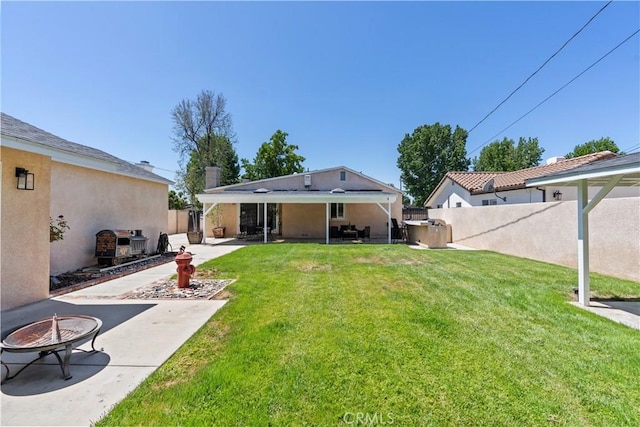 15037 Hiawatha St, Mission Hills San Fernando, CA 91345 - back of house with a fire pit, a patio, and stucco siding