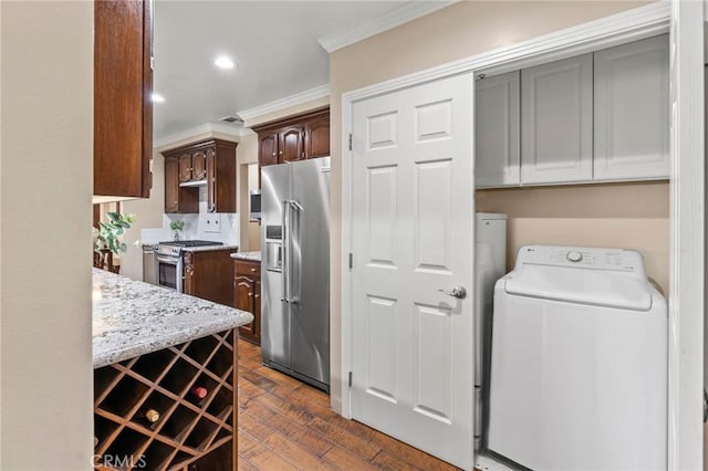 15037 Hiawatha St, Mission Hills San Fernando, CA 91345 - kitchen with washer / dryer, appliances with stainless steel finishes, crown molding, light stone countertops, and dark wood-style flooring