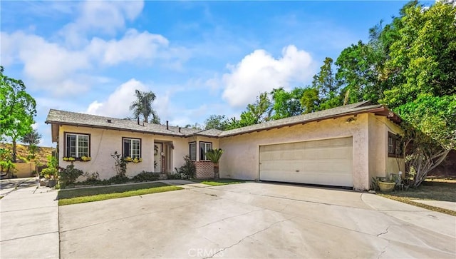 822 Corona Ave, Corona, CA 92879 - ranch-style home with stucco siding, a garage, and concrete driveway
