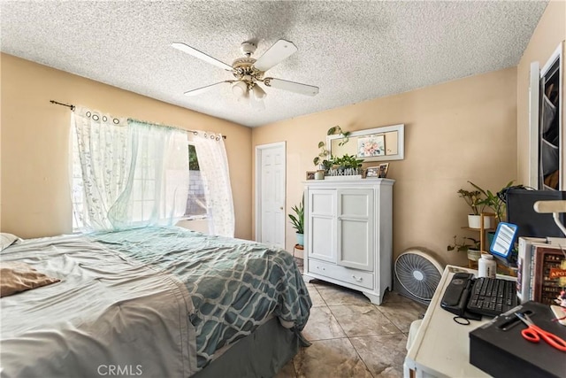 822 Corona Ave, Corona, CA 92879 - bedroom with a textured ceiling and a ceiling fan