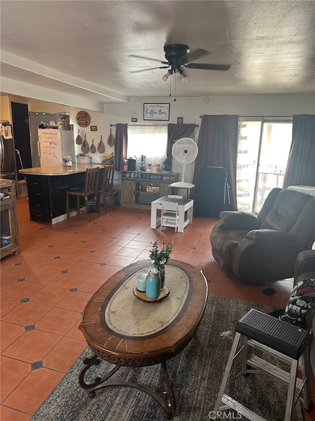 11222 Pinon Ave, Hesperia, CA 92345 - living area featuring light tile patterned floors, a textured ceiling, and ceiling fan