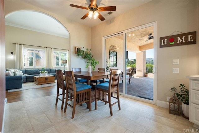 29861 Kirsten Ln, Vista, CA 92084 - dining area featuring ceiling fan, arched walkways, plenty of natural light, and ornamental molding
