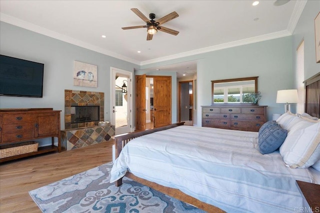 29861 Kirsten Ln, Vista, CA 92084 - bedroom featuring wood finished floors, a fireplace with raised hearth, recessed lighting, crown molding, and ceiling fan