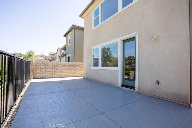 26370 Piazza Di Sarro, Newhall, CA 91321 - fenced backyard featuring a patio area