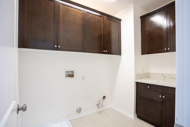 26370 Piazza Di Sarro, Newhall, CA 91321 - laundry room with cabinet space, gas dryer hookup, washer hookup, and light tile patterned floors