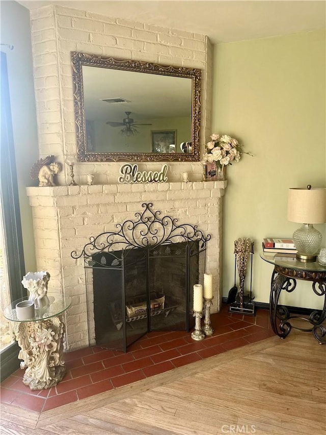 130 Cary Ln, Pomona, CA 91767 - detailed view of a brick fireplace and ceiling fan