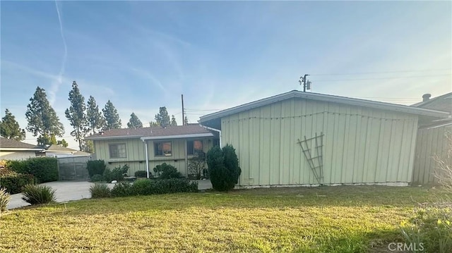 130 Cary Ln, Pomona, CA 91767 - rear view of property featuring board and batten siding