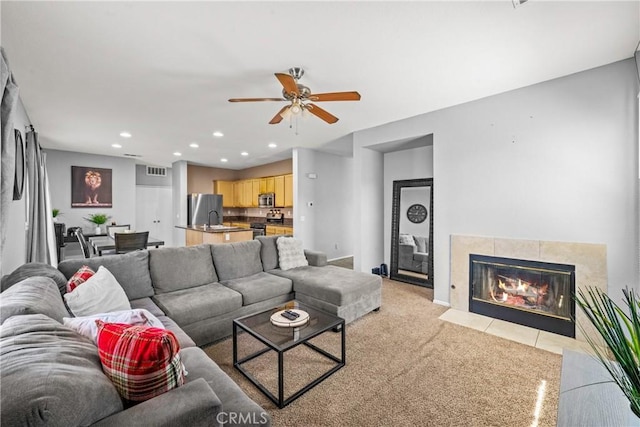 3260 Ivy Ct, Perris, CA 92571 - living area featuring recessed lighting, a ceiling fan, light colored carpet, and a fireplace
