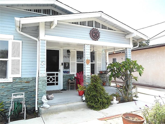 2616 S Denison Ave, San Pedro, CA 90731 - view of exterior entry featuring stone siding and covered porch