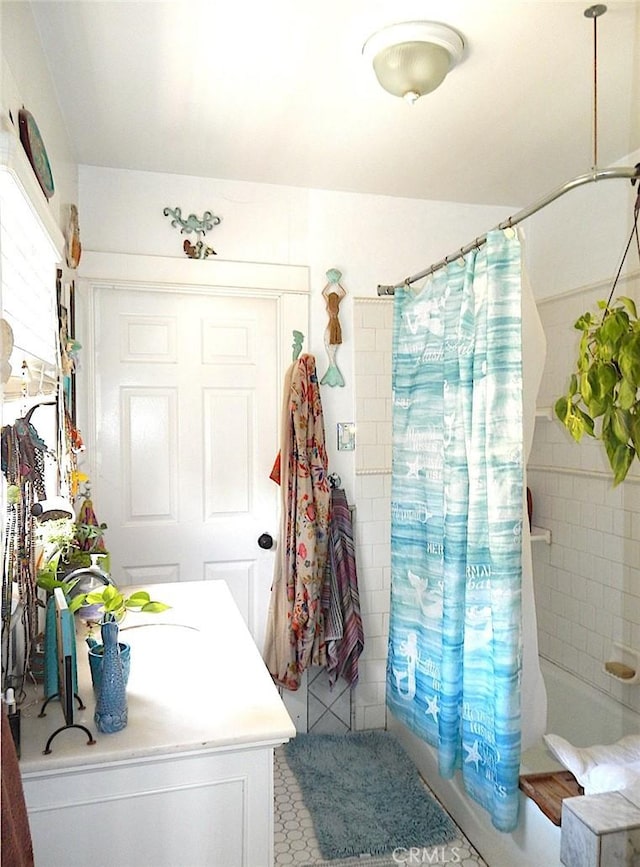 2616 S Denison Ave, San Pedro, CA 90731 - bathroom featuring vanity and shower / tub combo with curtain