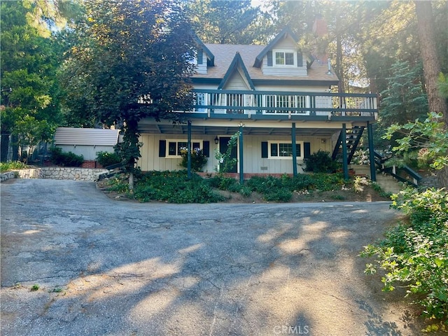 31016 Summit Dr, Running Springs, CA 92382 - view of front of house featuring stairs, a wooden deck, and board and batten siding