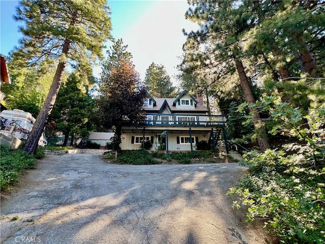 31016 Summit Dr, Running Springs, CA 92382 - view of front facade with asphalt driveway, stairs, and a deck