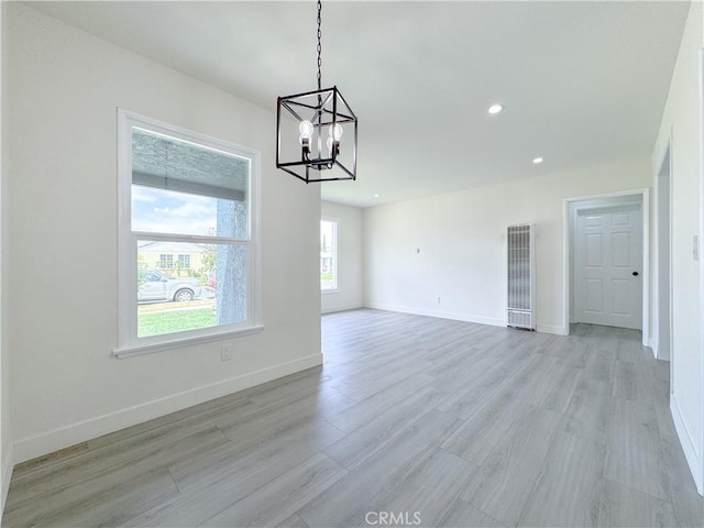 1512 S Butler Ave, Compton, CA 90221 - unfurnished dining area with a heating unit, a chandelier, light wood-style floors, and recessed lighting