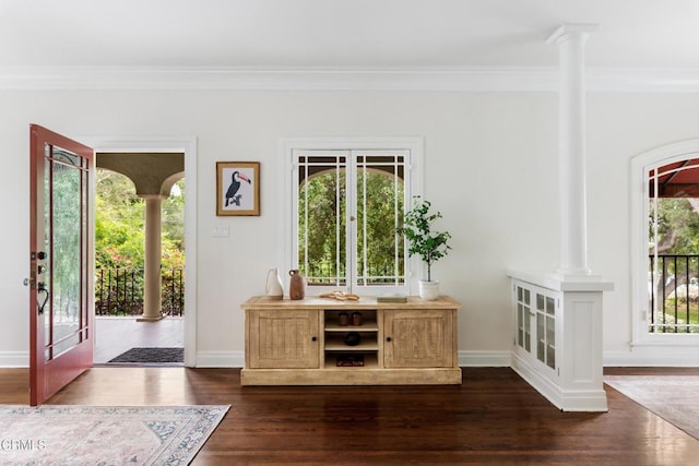 413 Sycamore Pl, Sierra Madre, CA 91024 - foyer entrance featuring ornamental molding, decorative columns, and dark wood-type flooring