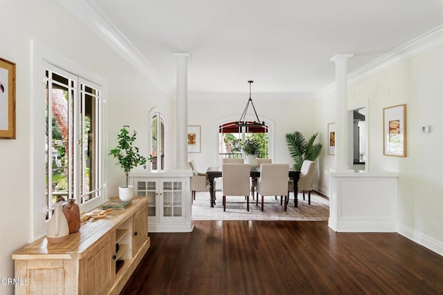 413 Sycamore Pl, Sierra Madre, CA 91024 - entrance foyer featuring ornate columns, plenty of natural light, dark wood-style floors, and ornamental molding