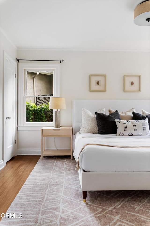 413 Sycamore Pl, Sierra Madre, CA 91024 - bedroom with wood finished floors and ornamental molding