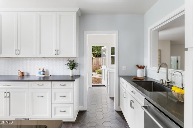 413 Sycamore Pl, Sierra Madre, CA 91024 - kitchen featuring dark countertops, dishwasher, and decorative backsplash