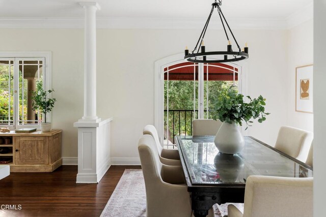 413 Sycamore Pl, Sierra Madre, CA 91024 - dining area featuring a chandelier, dark wood-type flooring, decorative columns, and ornamental molding