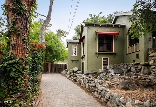 413 Sycamore Pl, Sierra Madre, CA 91024 - view of home's exterior featuring stucco siding and a gate