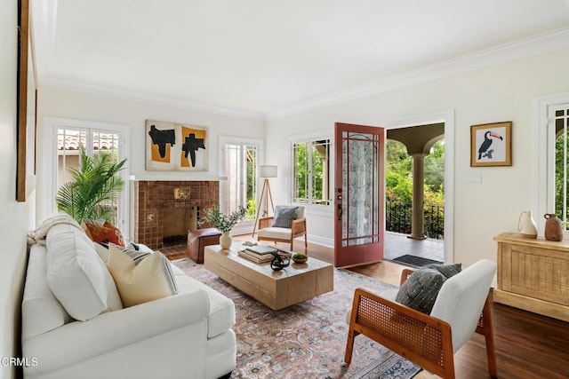413 Sycamore Pl, Sierra Madre, CA 91024 - living area featuring plenty of natural light, ornamental molding, wood finished floors, and a tile fireplace