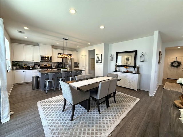 27265 Graphite Dr, Menifee, CA 92584 - dining space with dark wood-type flooring and recessed lighting