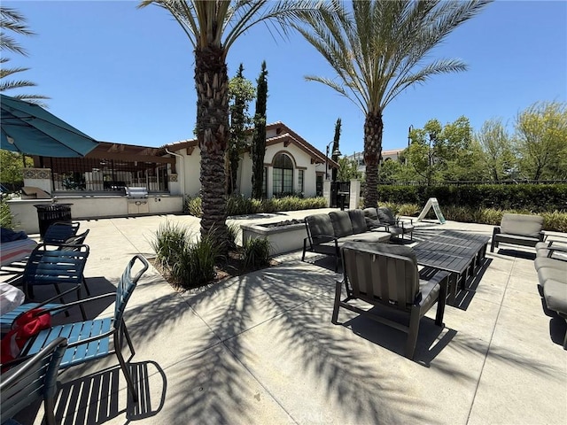 27265 Graphite Dr, Menifee, CA 92584 - view of patio with an outdoor kitchen and an outdoor living space