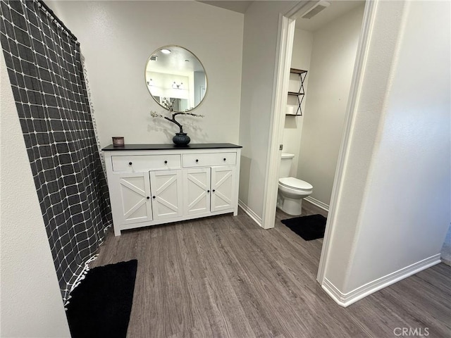 27265 Graphite Dr, Menifee, CA 92584 - bathroom featuring wood finished floors and vanity