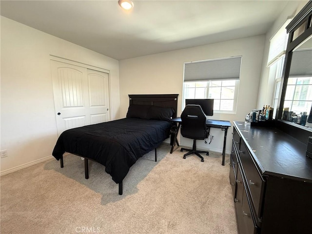27265 Graphite Dr, Menifee, CA 92584 - bedroom with light colored carpet, a desk, and a closet