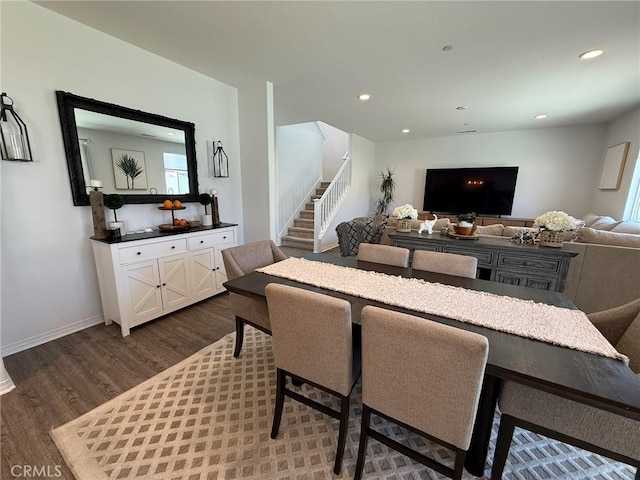 27265 Graphite Dr, Menifee, CA 92584 - dining space with dark wood-style flooring, stairway, and recessed lighting