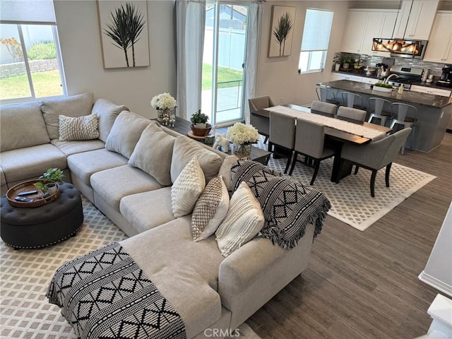 27265 Graphite Dr, Menifee, CA 92584 - living area featuring wood finished floors and plenty of natural light