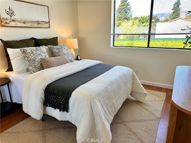 570 Peach St Unit 25, San Luis Obispo, CA 93401 - bedroom featuring wood finished floors and baseboards