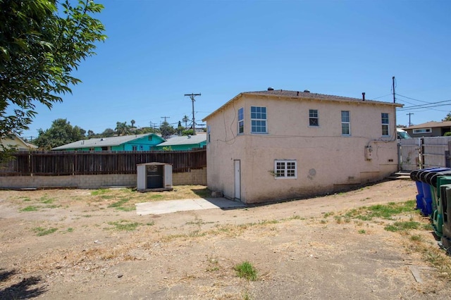 5412 Cervantes Ave, San Diego, CA 92114 - rear view of house with a fenced backyard and stucco siding