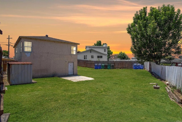 5412 Cervantes Ave, San Diego, CA 92114 - yard at dusk featuring a fenced backyard and a storage shed