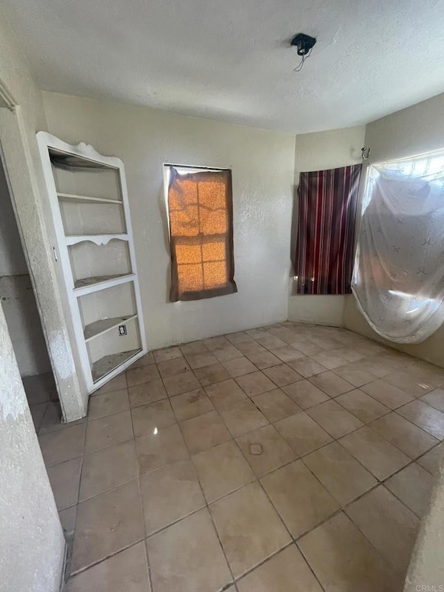 5412 Cervantes Ave, San Diego, CA 92114 - unfurnished bedroom featuring tile patterned floors and a textured ceiling