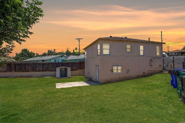 5412 Cervantes Ave, San Diego, CA 92114 - back of house at dusk featuring a fenced backyard, stucco siding, and a patio area