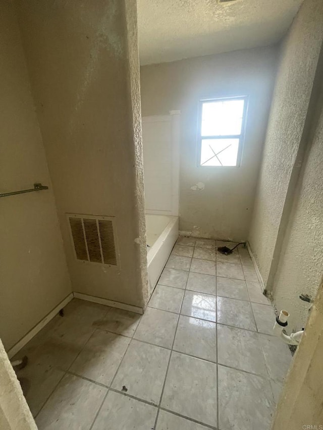 5412 Cervantes Ave, San Diego, CA 92114 - full bath with a textured wall, a textured ceiling, and tile patterned floors