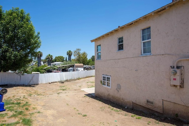5412 Cervantes Ave, San Diego, CA 92114 - view of side of property with stucco siding and crawl space