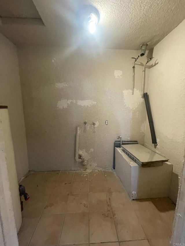 5412 Cervantes Ave, San Diego, CA 92114 - below grade area featuring a textured ceiling and tile patterned floors