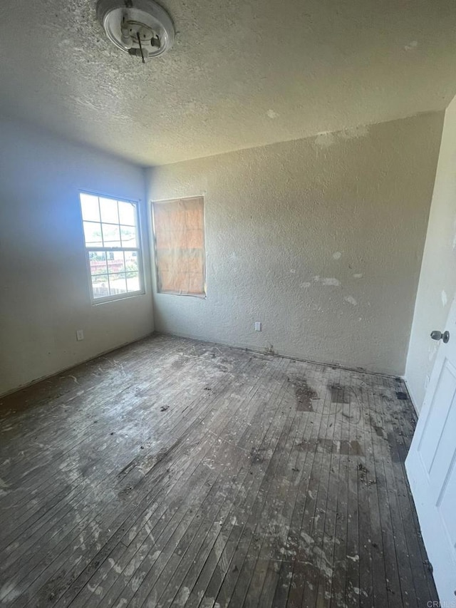 5412 Cervantes Ave, San Diego, CA 92114 - empty room with hardwood / wood-style floors and a textured ceiling