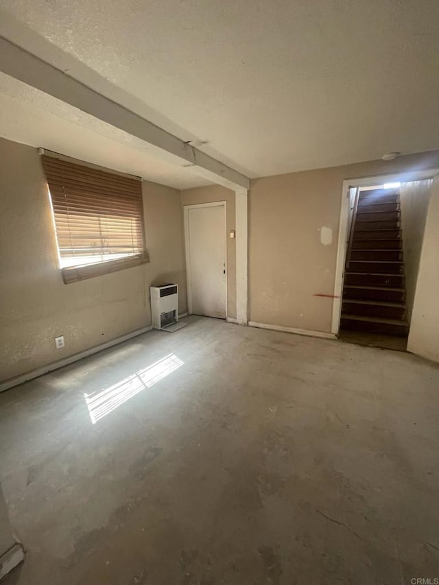 5412 Cervantes Ave, San Diego, CA 92114 - unfurnished room featuring concrete flooring, stairway, and heating unit