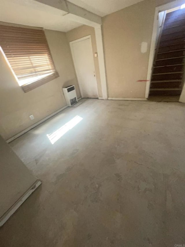 5412 Cervantes Ave, San Diego, CA 92114 - spare room with heating unit and concrete floors