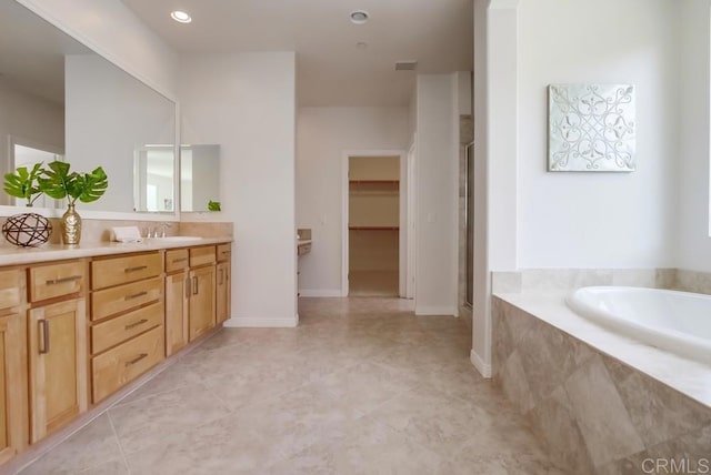 15240 Cayenne Creek Ct, San Diego, CA 92127 - bathroom with vanity, a garden tub, a stall shower, a spacious closet, and tile patterned flooring
