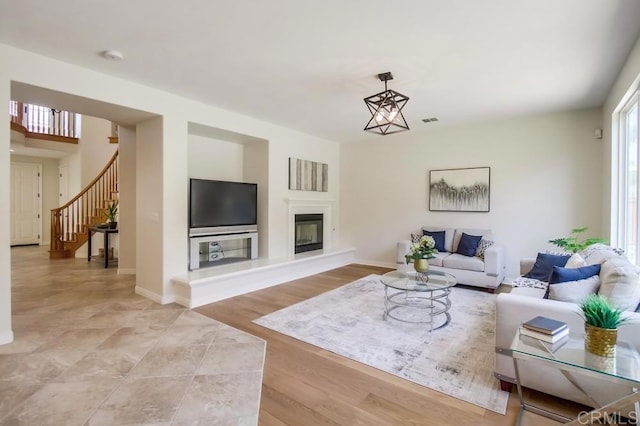15240 Cayenne Creek Ct, San Diego, CA 92127 - living room with stairs and a glass covered fireplace