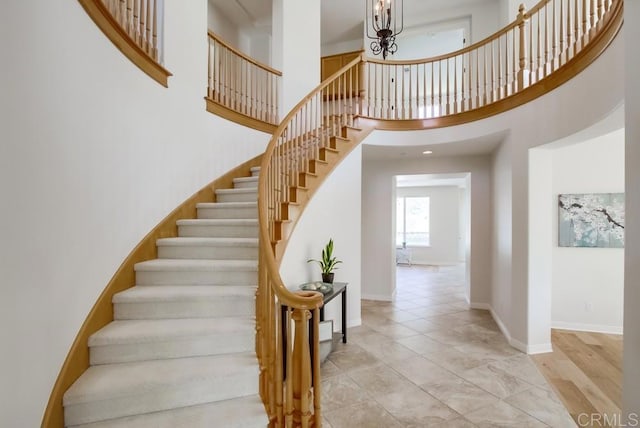15240 Cayenne Creek Ct, San Diego, CA 92127 - stairway featuring a chandelier and a high ceiling