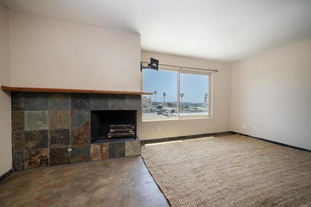 5155 W Point Loma Blvd Unit 9, San Diego, CA 92107 - unfurnished living room with concrete floors and a tile fireplace