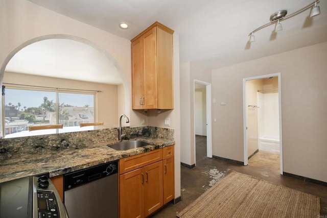 5155 W Point Loma Blvd Unit 9, San Diego, CA 92107 - kitchen with dishwasher, arched walkways, dark stone countertops, recessed lighting, and concrete flooring