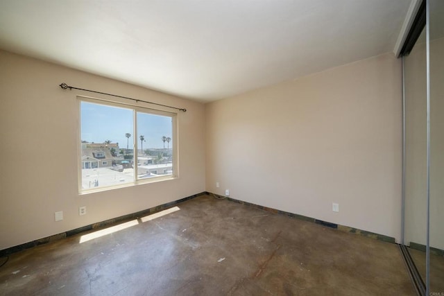 5155 W Point Loma Blvd Unit 9, San Diego, CA 92107 - empty room featuring unfinished concrete floors and baseboards