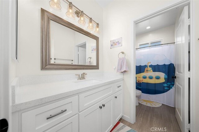 717 Lingel Dr, El Cajon, CA 92019 - bathroom featuring vanity, wood finished floors, and a shower with curtain
